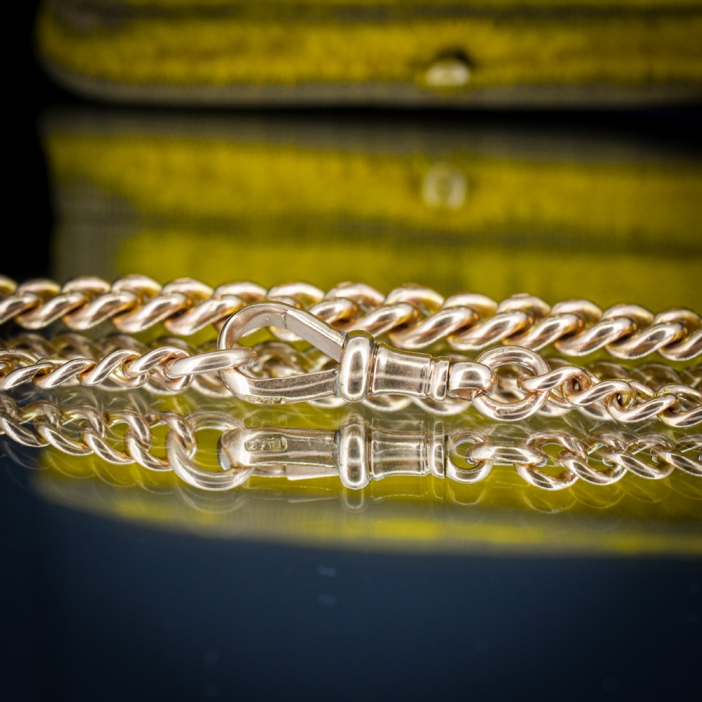 An antique 9ct yellow gold curb link chain bracelet with a swivel dog clip clasp. View V