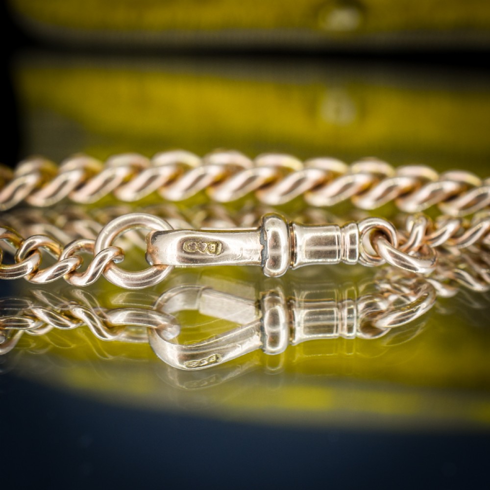 An antique 9ct yellow gold curb link chain bracelet with a swivel dog clip clasp. View VI