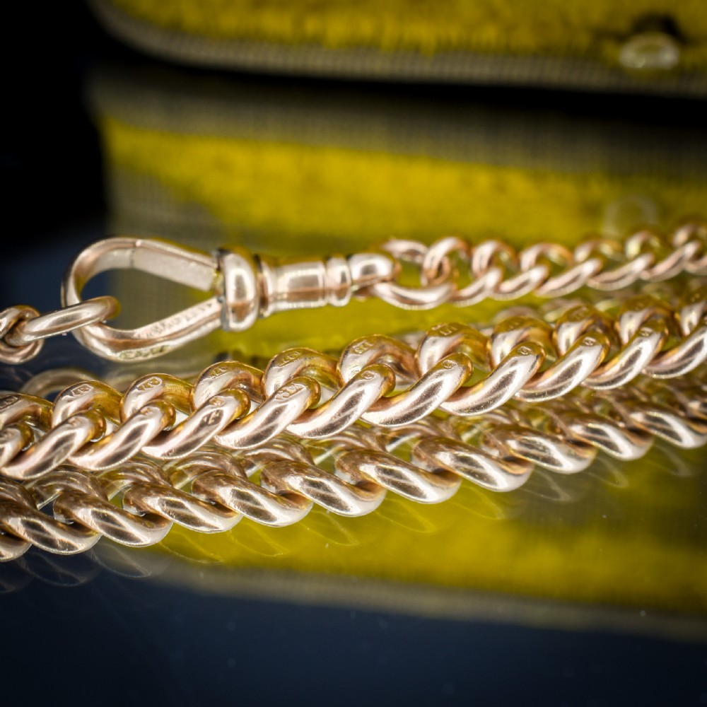 An antique 9ct yellow gold curb link chain bracelet with a swivel dog clip clasp. View VIII