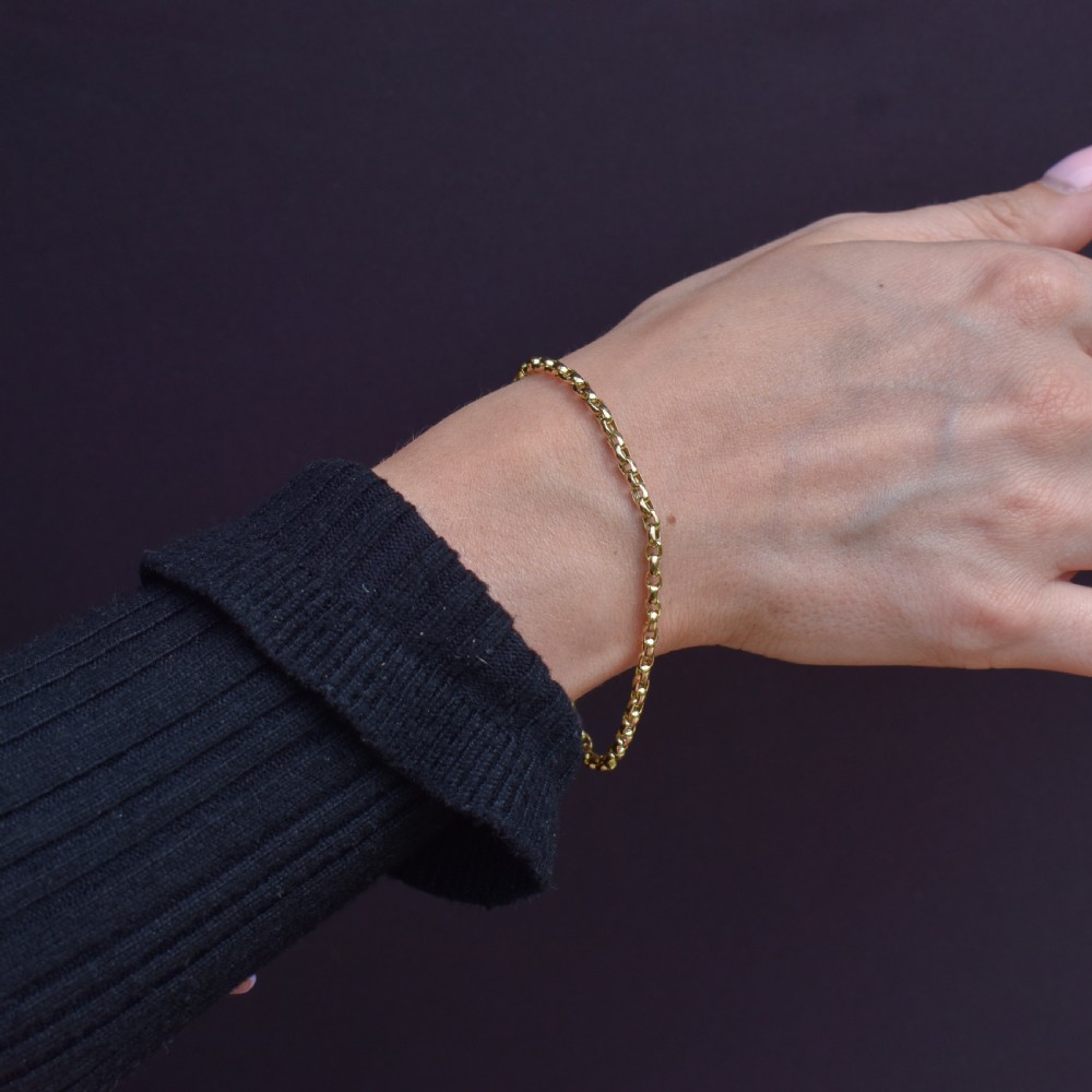 An antique 15ct warm gold oval curb link bracelet featuring stamped links and a dog clip swivel clasp. View II