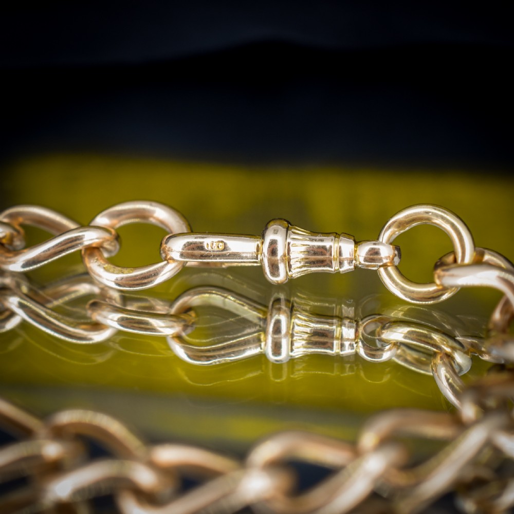 An antique 15ct warm gold oval curb link bracelet featuring stamped links and a dog clip swivel clasp. View VI