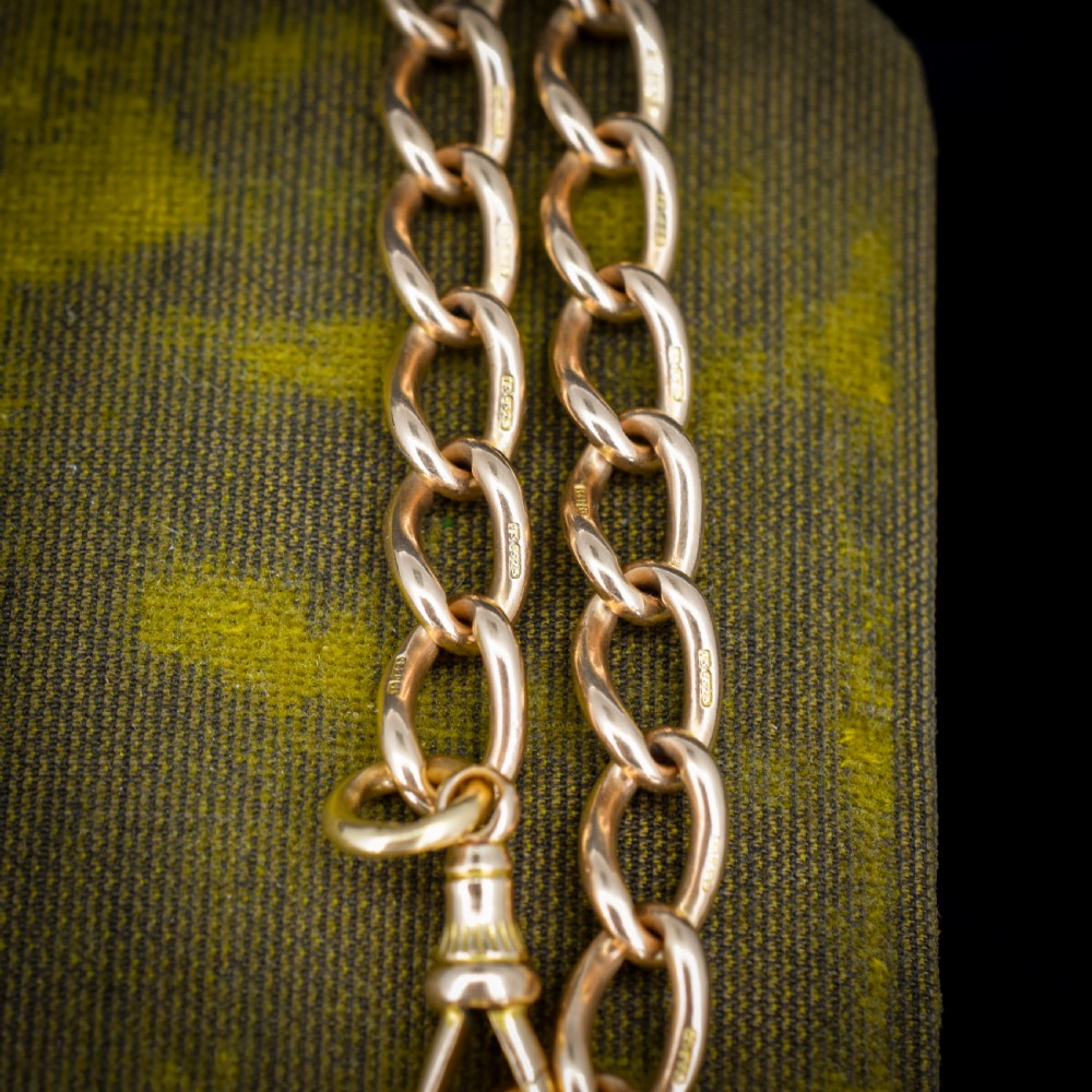 An antique 15ct warm gold oval curb link bracelet featuring stamped links and a dog clip swivel clasp. View VII
