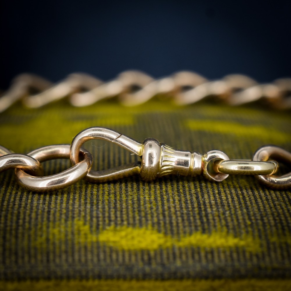 An antique 15ct warm gold oval curb link bracelet featuring stamped links and a dog clip swivel clasp. View VIII