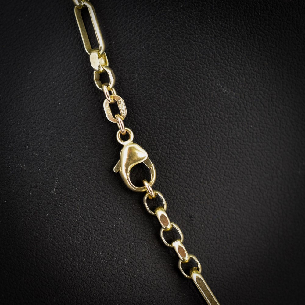 A vintage 9ct yellow gold fancy link chain necklace displayed inside a blue velvet fitted box. View IV