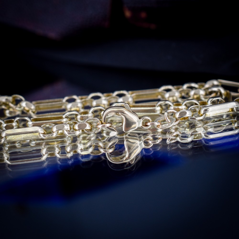 A vintage 9ct yellow gold fancy link chain necklace displayed inside a blue velvet fitted box. View VI