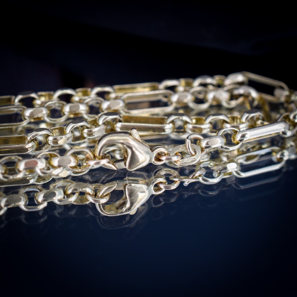 A vintage 9ct yellow gold fancy link chain necklace displayed inside a blue velvet fitted box. View VII