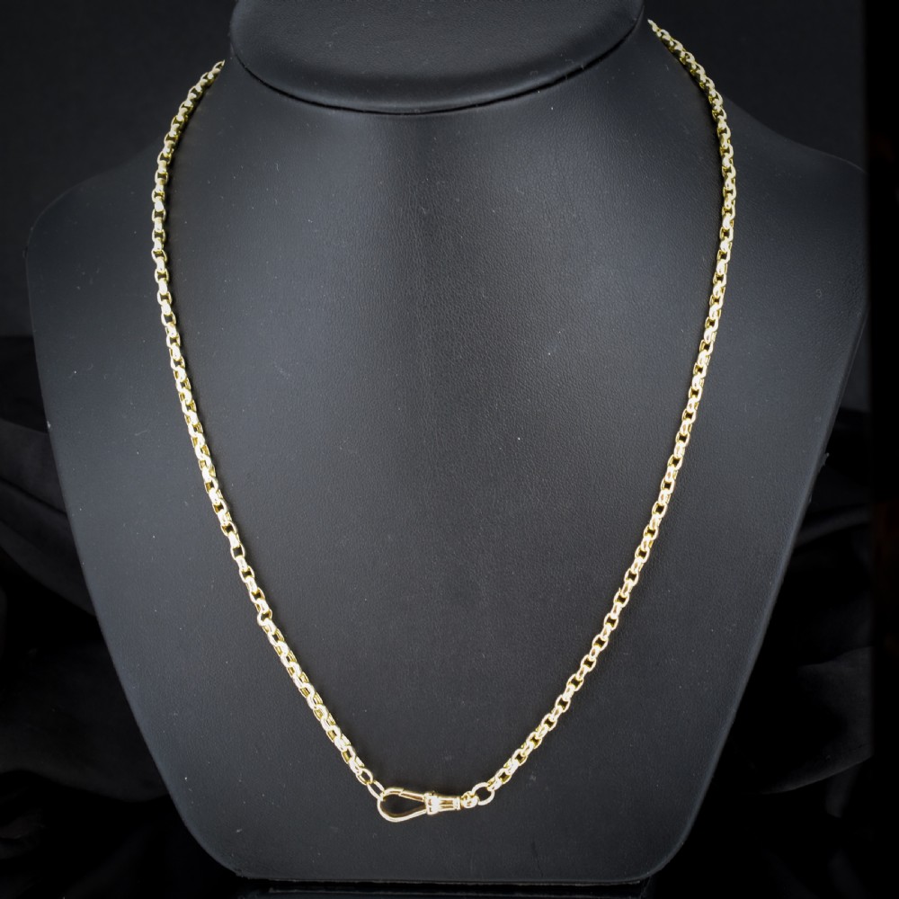 An antique Victorian yellow gold faceted link chain measuring 21.5 inches with a dog clip clasp. View II