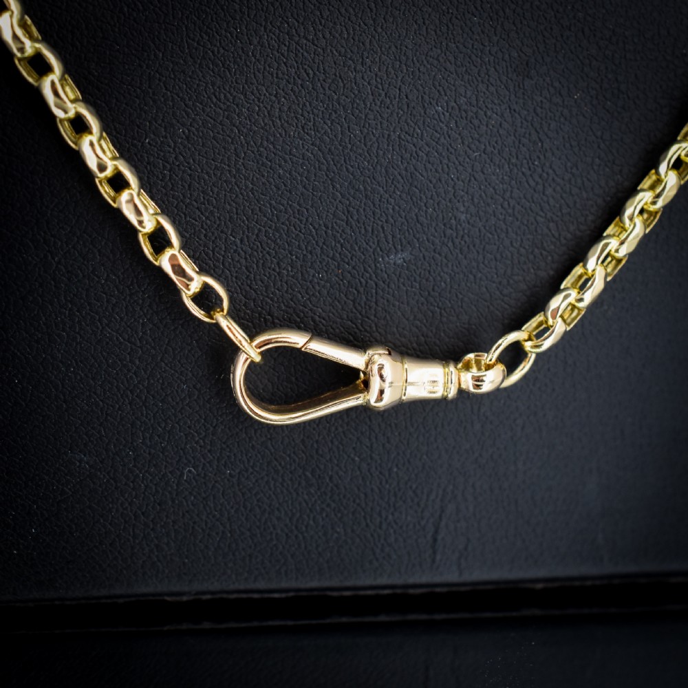 An antique Victorian yellow gold faceted link chain measuring 21.5 inches with a dog clip clasp. View III