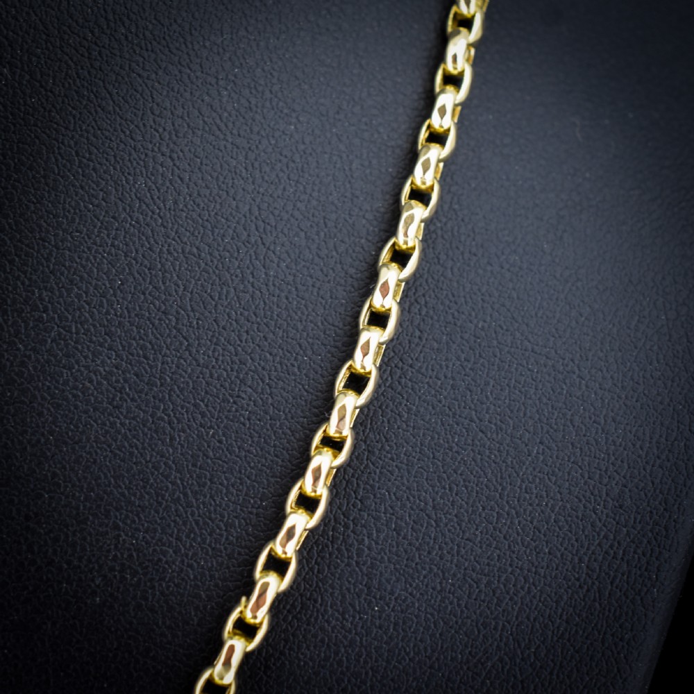 An antique Victorian yellow gold faceted link chain measuring 21.5 inches with a dog clip clasp. View IV