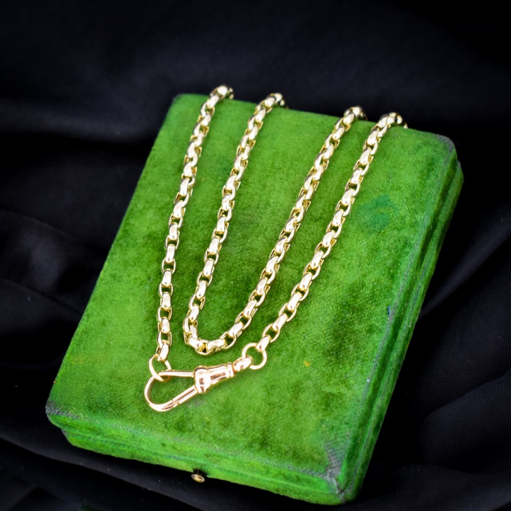 An antique Victorian yellow gold faceted link chain measuring 21.5 inches with a dog clip clasp. View V