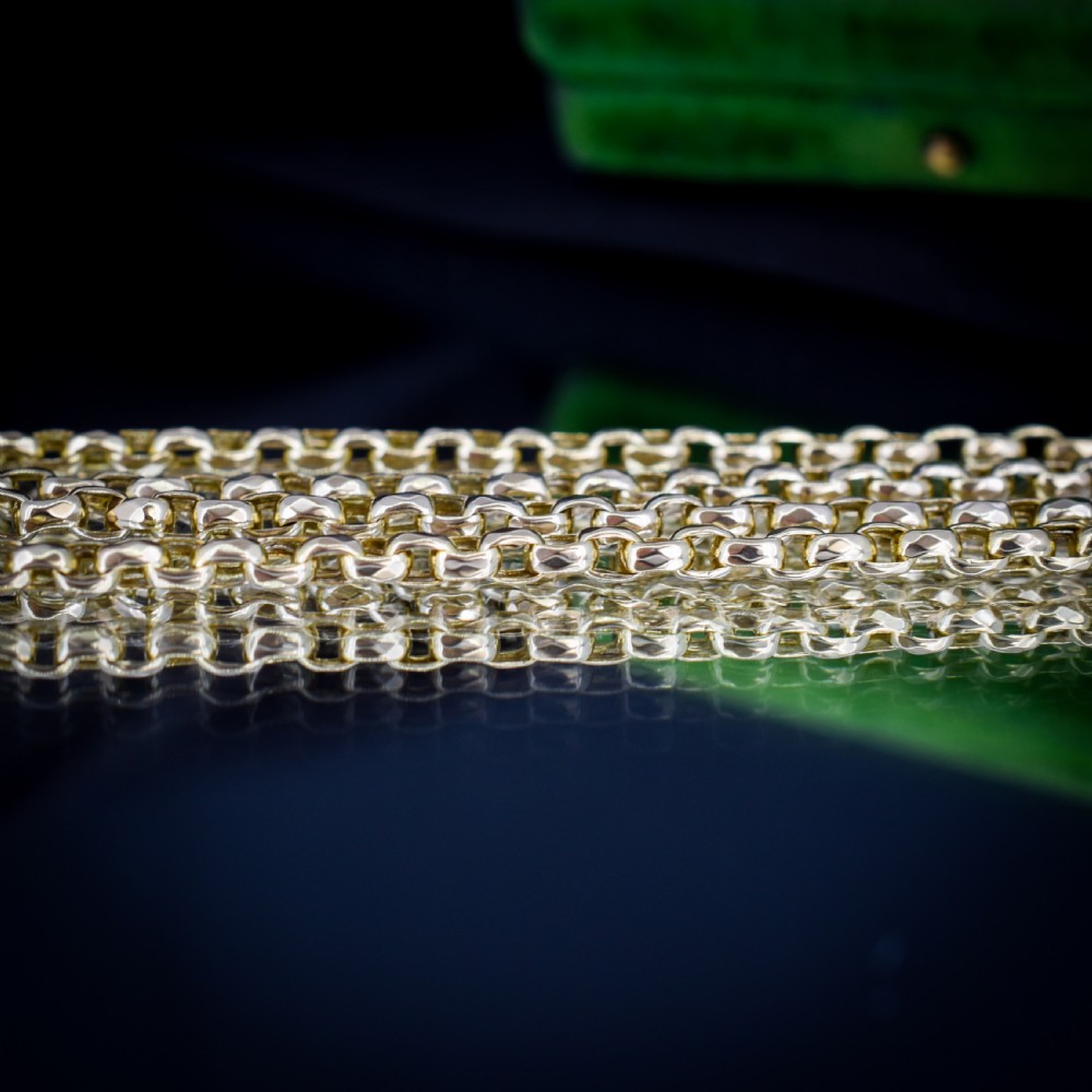 An antique Victorian yellow gold faceted link chain measuring 21.5 inches with a dog clip clasp. View VI