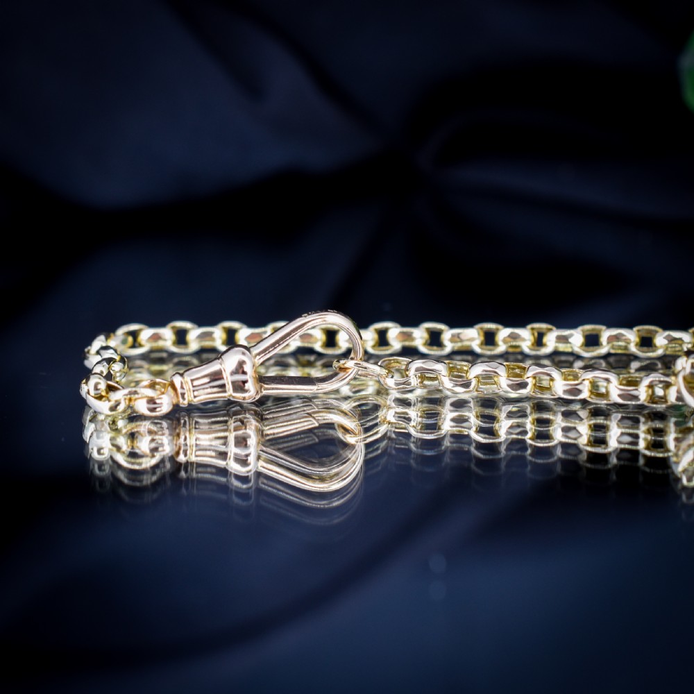 An antique Victorian yellow gold faceted link chain measuring 21.5 inches with a dog clip clasp. View VII