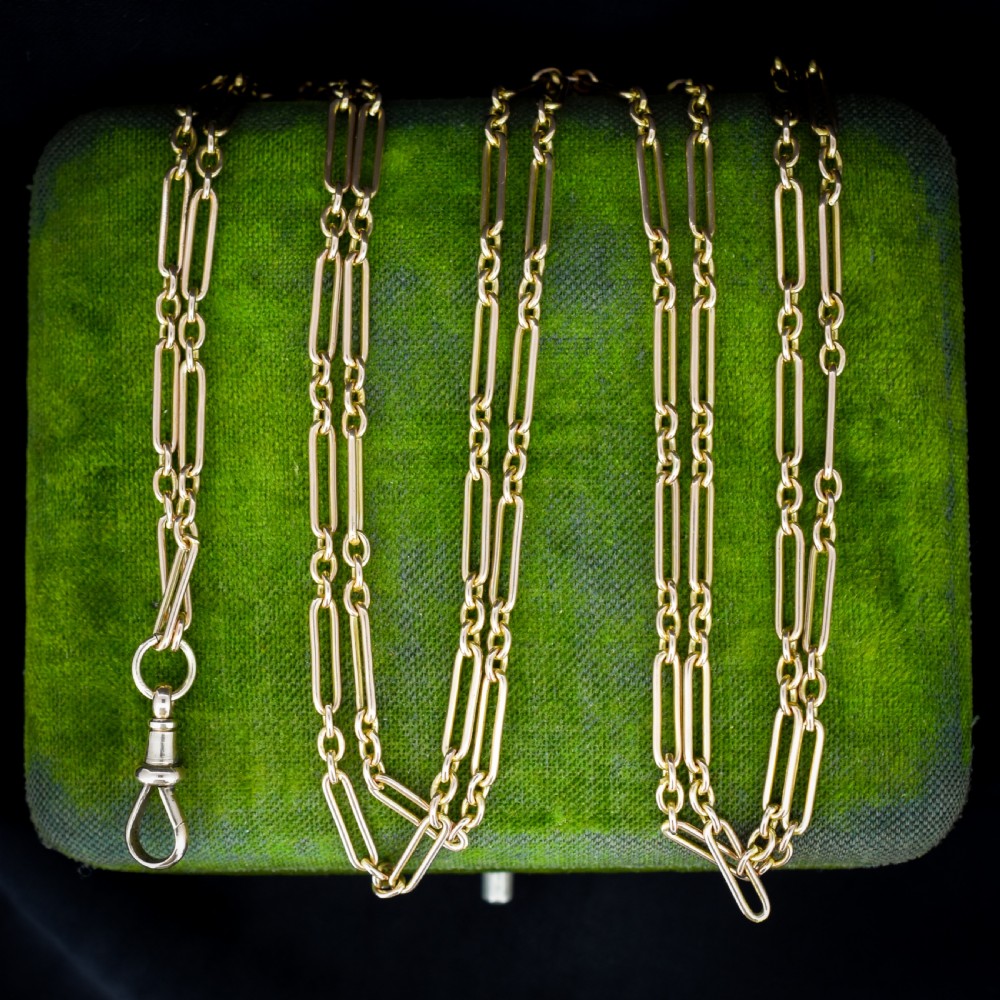 An antique long 9ct yellow gold paper link chain necklace layered around a black display bust with a swivel dog clip clasp. View VI