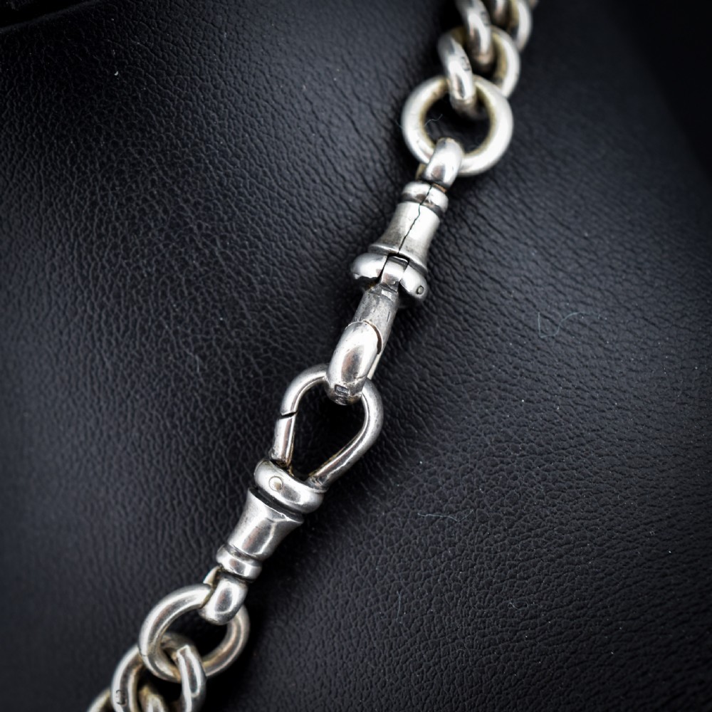An antique sterling silver curb link Albert watch chain featuring a T-bar fastener and swivel clip. View VII