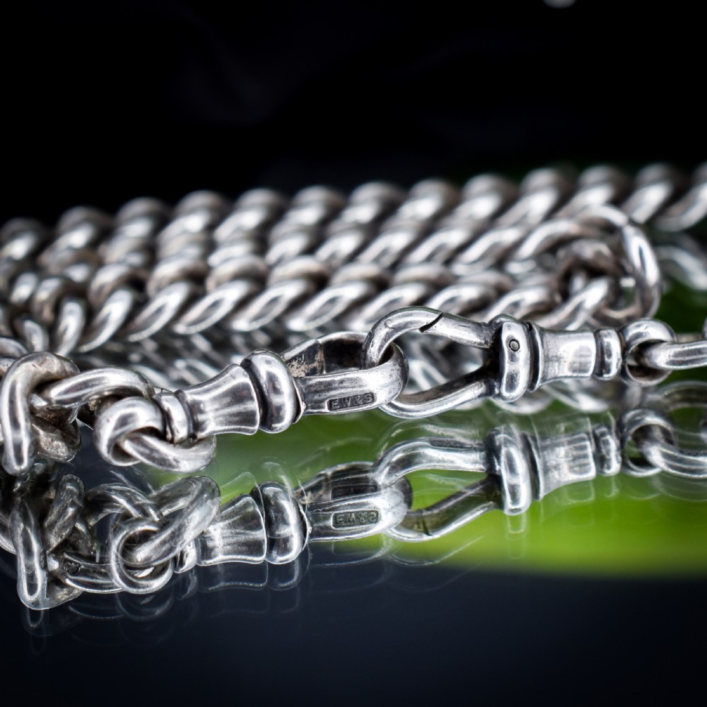 An antique sterling silver curb link Albert watch chain featuring a T-bar fastener and swivel clip. View X