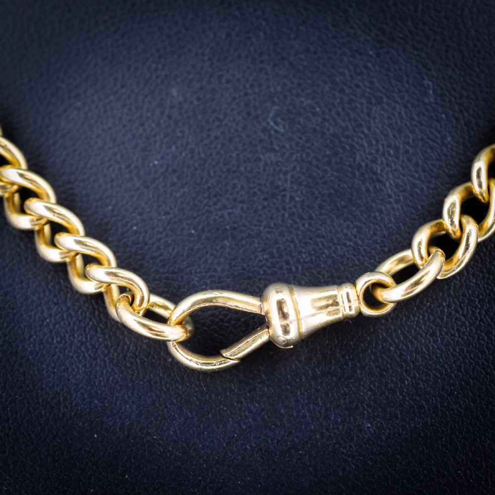 An 18ct yellow gold curb link chain necklace featuring a traditional dog clip fastener. View VI