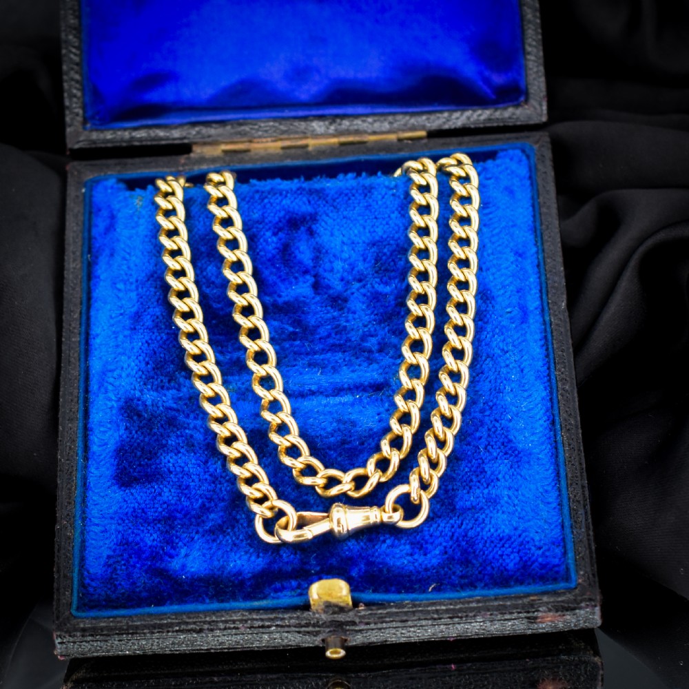 An 18ct yellow gold curb link chain necklace featuring a traditional dog clip fastener. View VIII