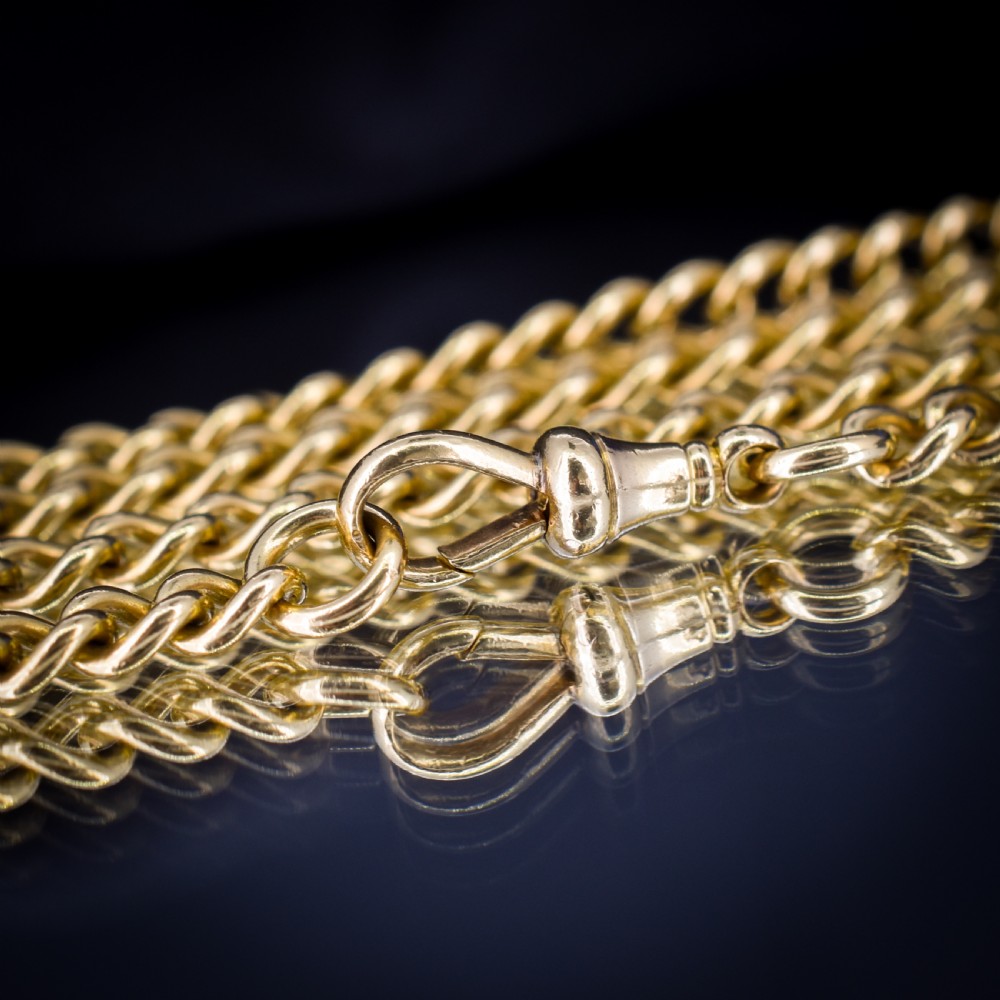 An 18ct yellow gold curb link chain necklace featuring a traditional dog clip fastener. View X