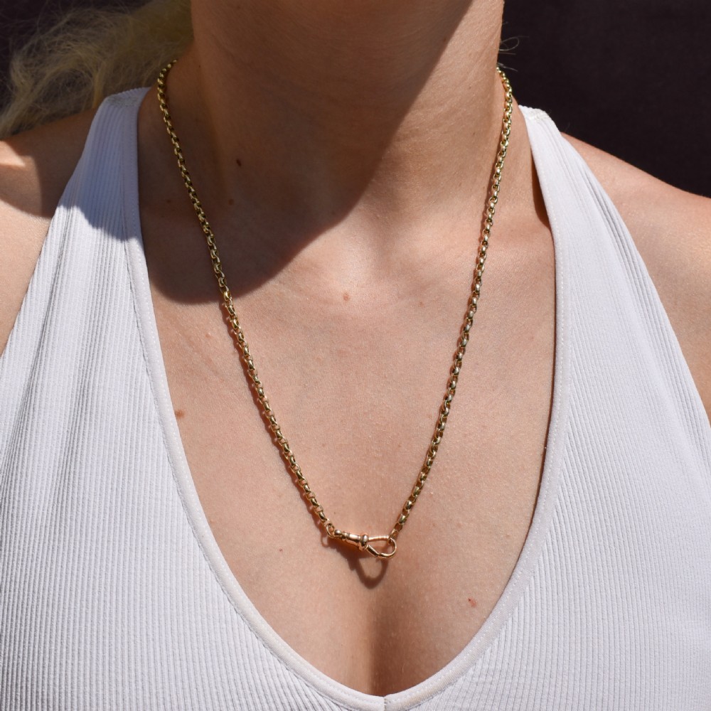 A Victorian 9ct gold chain necklace featuring faceted links and a swivel dog clip fastener. View II
