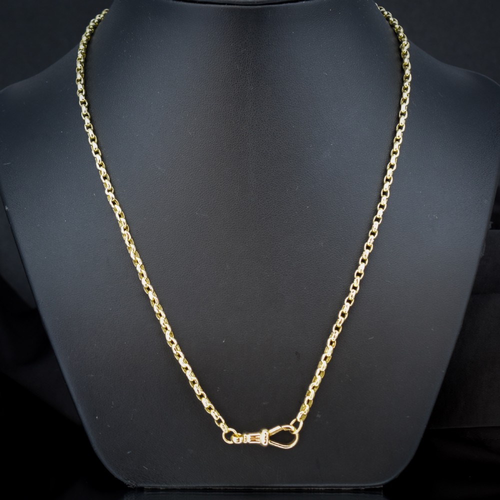 A Victorian 9ct gold chain necklace featuring faceted links and a swivel dog clip fastener. View V