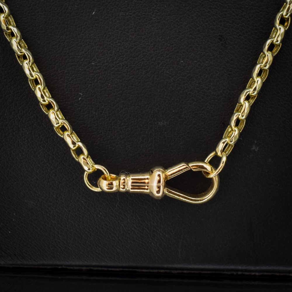 A Victorian 9ct gold chain necklace featuring faceted links and a swivel dog clip fastener. View VI
