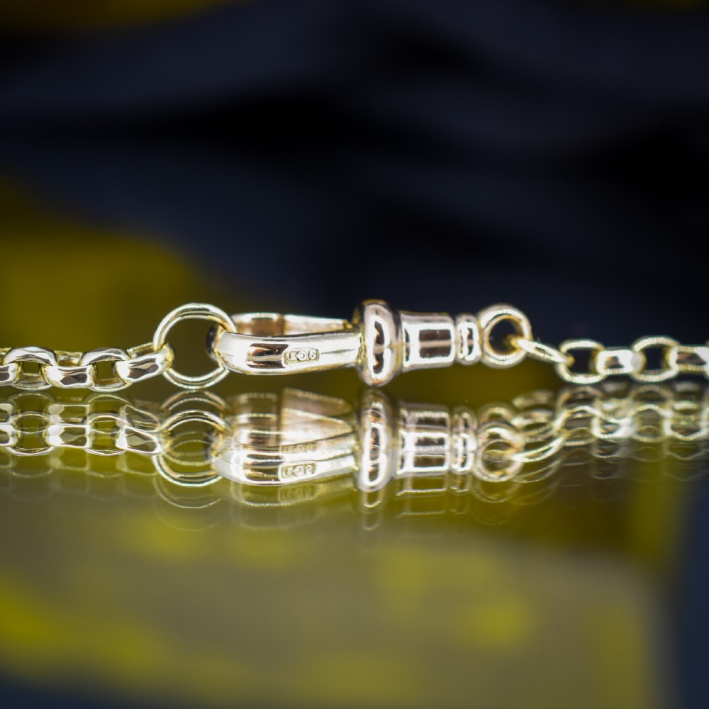A Victorian 9ct gold chain necklace featuring faceted links and a swivel dog clip fastener. View VIII