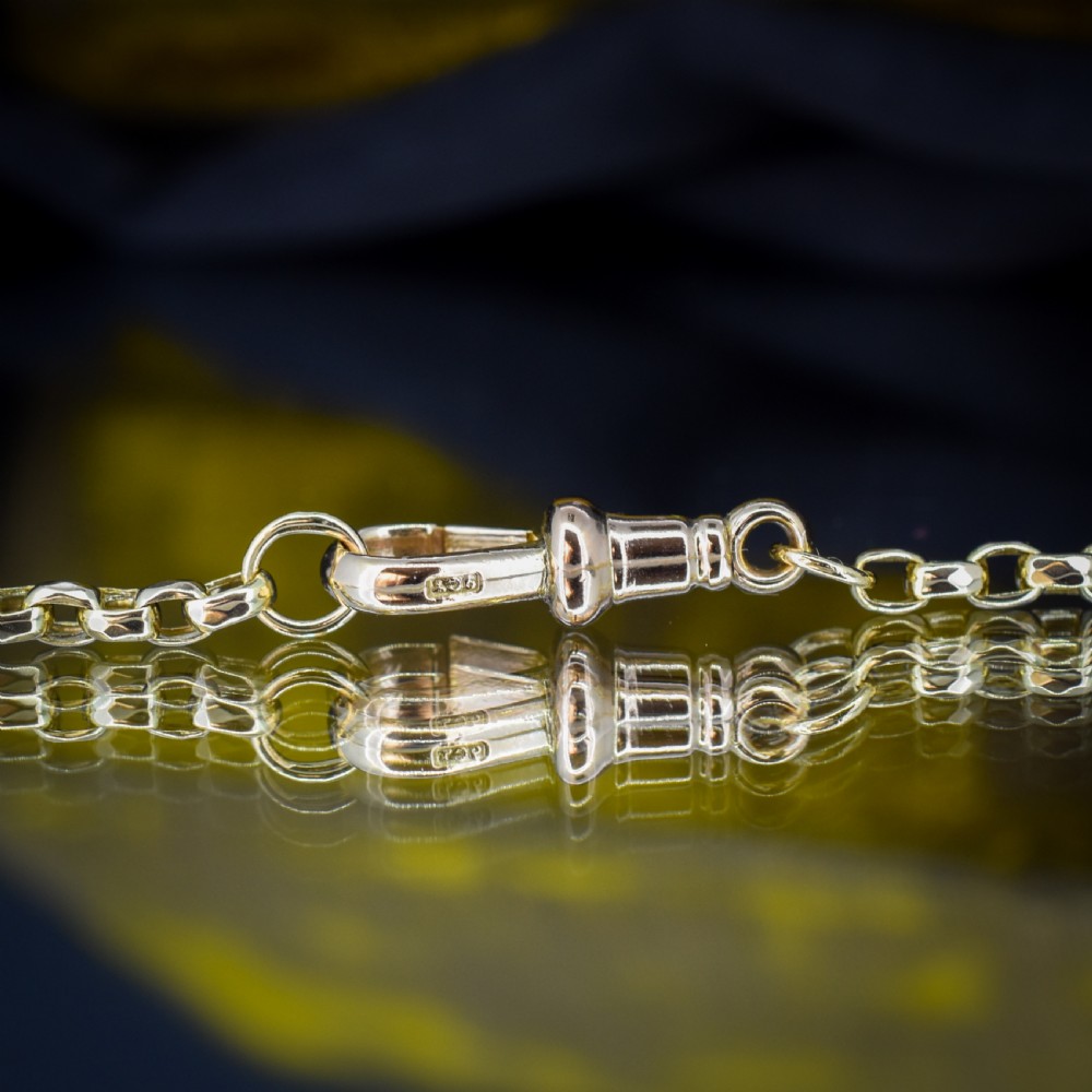 A Victorian 9ct gold chain necklace featuring faceted links and a swivel dog clip fastener. View IX