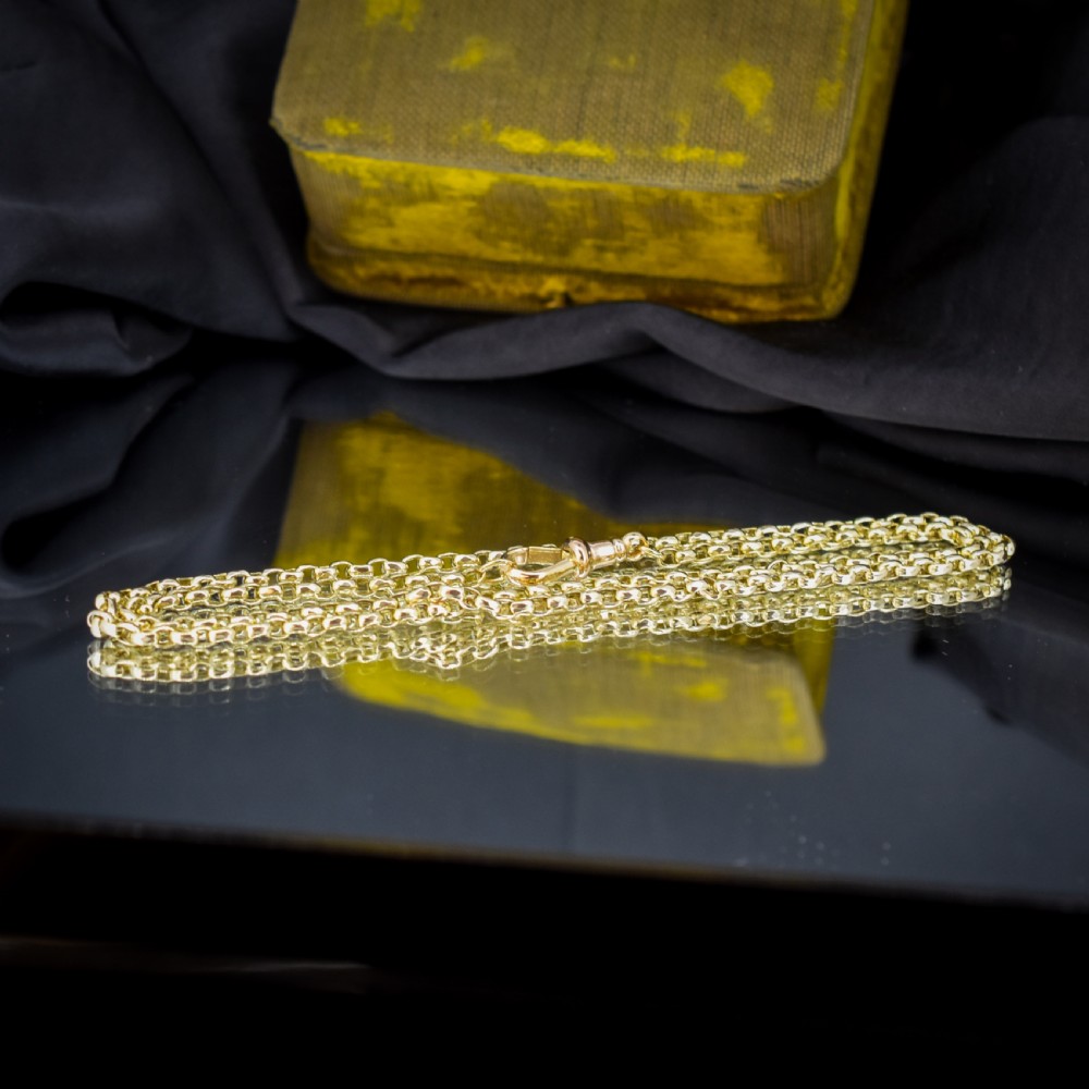 A Victorian 9ct gold chain necklace featuring faceted links and a swivel dog clip fastener. View X