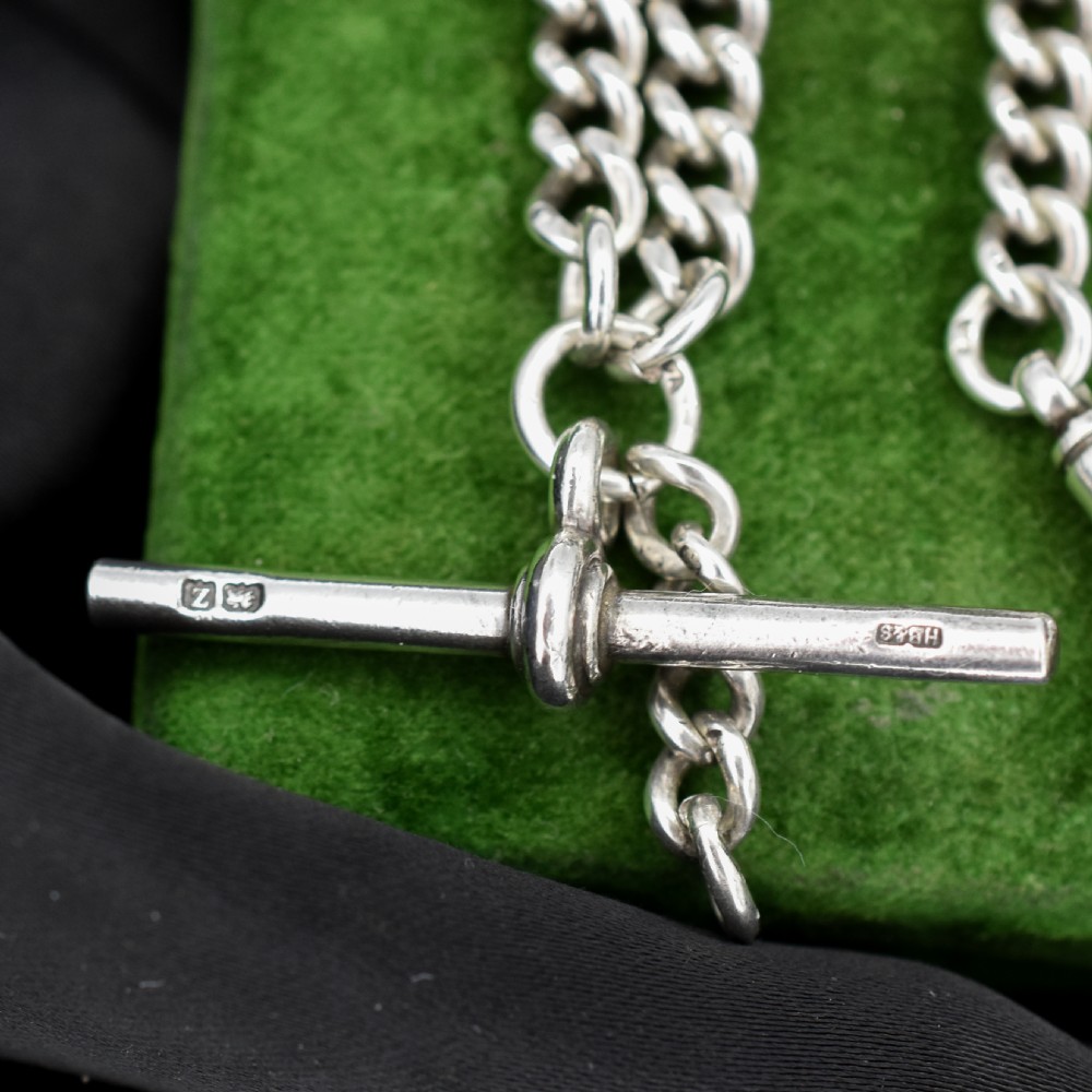 A sterling silver curb link Albert pocket watch chain featuring a T-bar attachment and swivel clasp. View II