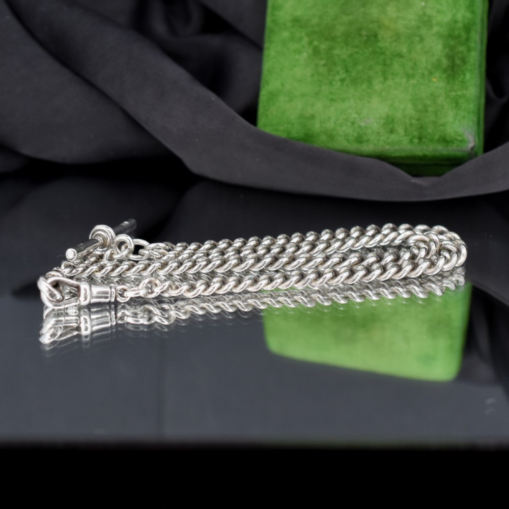 A sterling silver curb link Albert pocket watch chain featuring a T-bar attachment and swivel clasp. View III