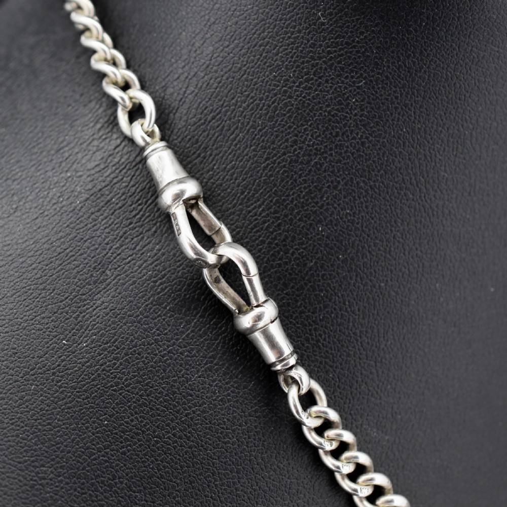 A sterling silver curb link Albert pocket watch chain featuring a T-bar attachment and swivel clasp. View V