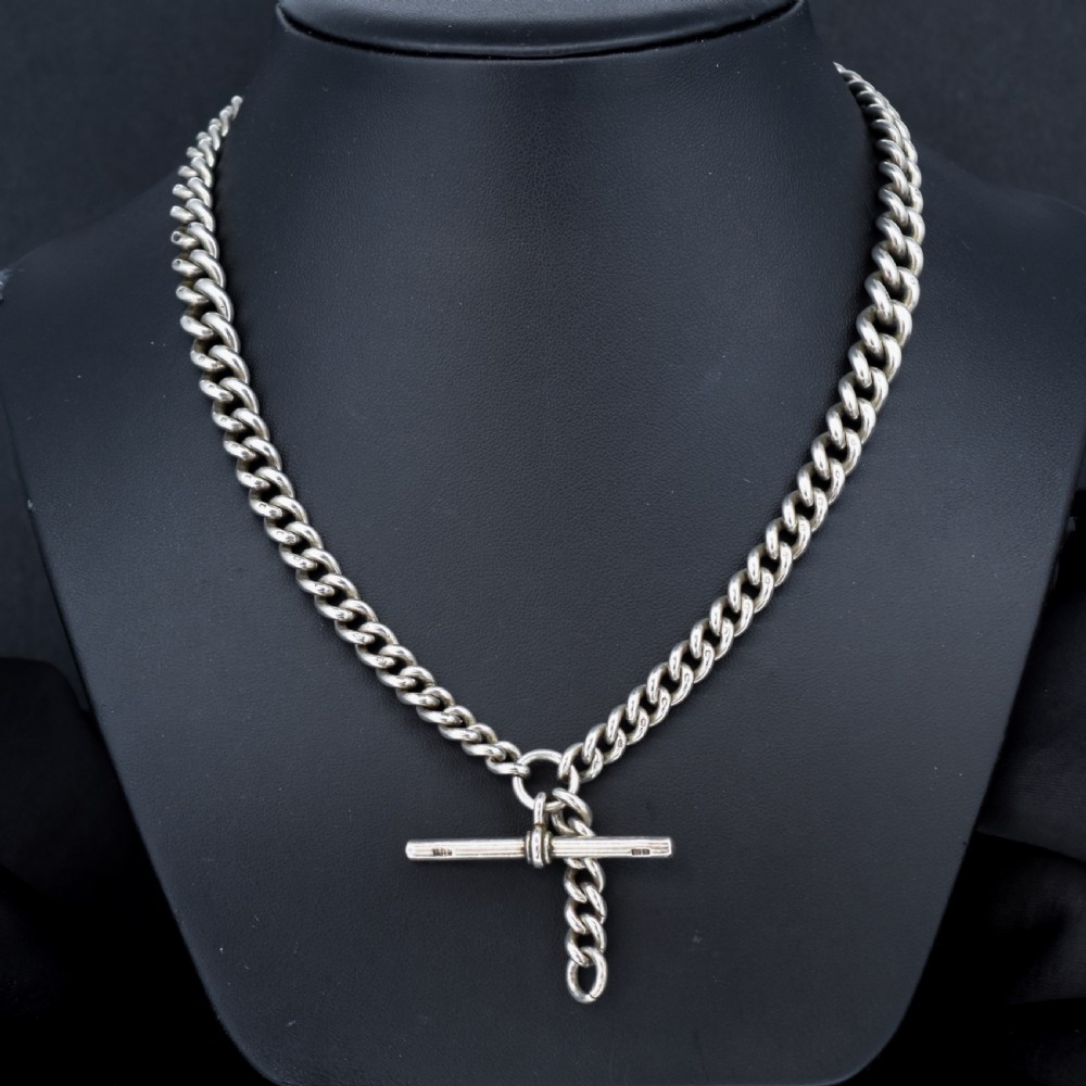 A sterling silver curb link Albert watch chain featuring a T-bar attachment and a swivel clip. View II