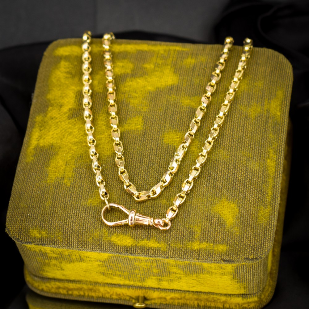 An antique 9ct yellow gold tulip link chain necklace featuring an integrated swivel dog clip clasp.