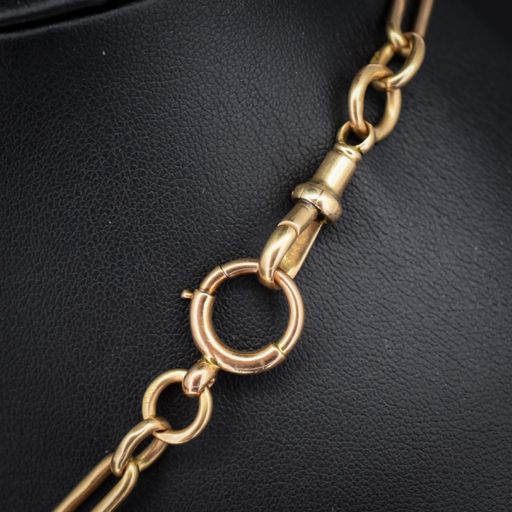 An antique 9ct gold trombone link Albert chain necklace with a T-bar, dog clip, and bolt ring clasp. View V