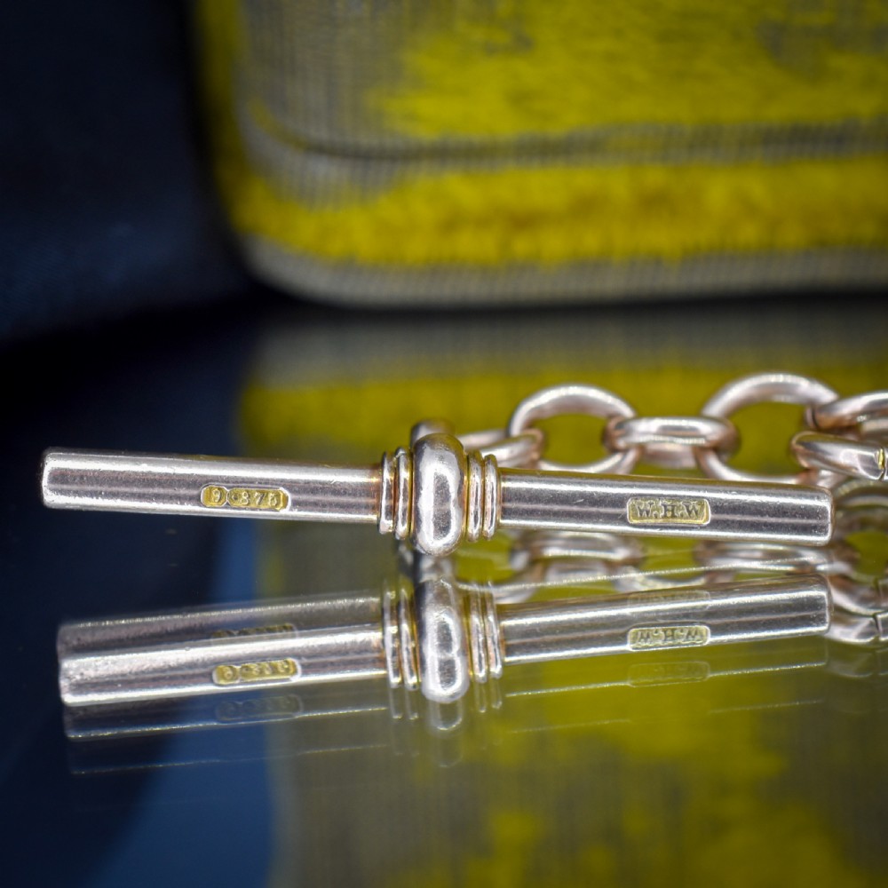 An antique 9ct gold trombone link Albert chain necklace with a T-bar, dog clip, and bolt ring clasp. View VII