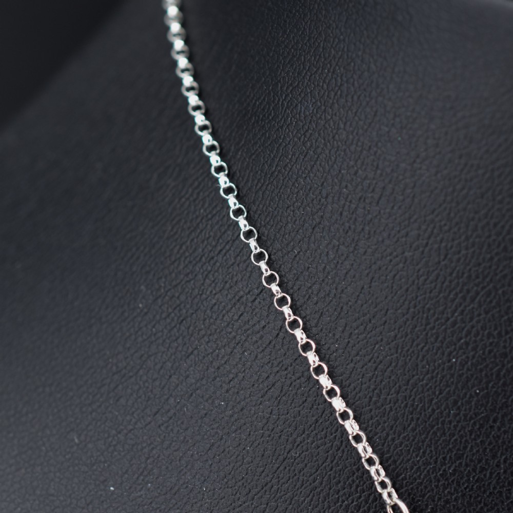 An antique silver festoon necklace featuring tiered oval cabochon moonstone drops suspended from a central chain. View V