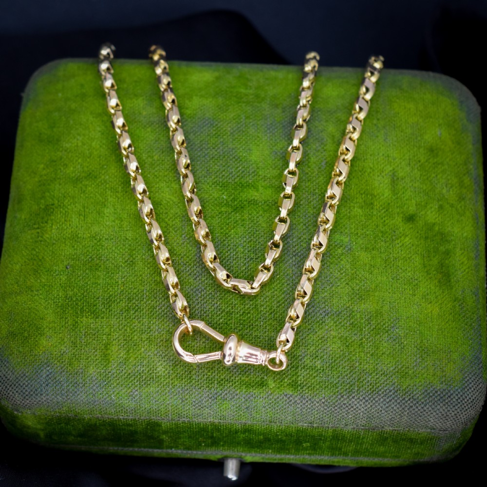 An antique 9ct yellow gold tulip link fancy chain necklace featuring a swivel dog clip clasp.