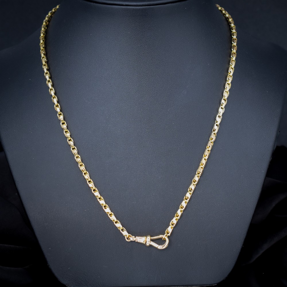 An antique 9ct yellow gold tulip link fancy chain necklace featuring a swivel dog clip clasp. View II