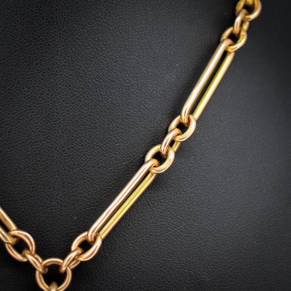 A 9ct yellow gold Albert chain necklace featuring alternating trombone links and a central T-bar pendant drop. View III
