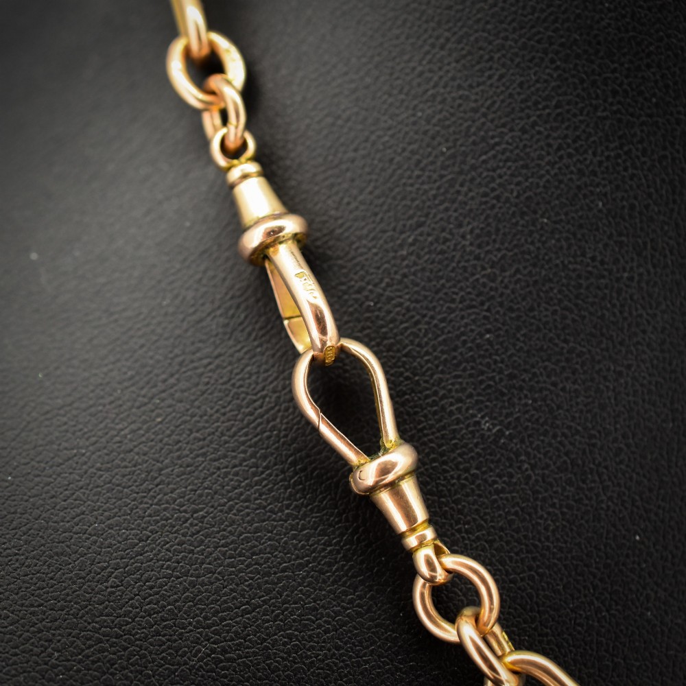 A 9ct yellow gold Albert chain necklace featuring alternating trombone links and a central T-bar pendant drop. View IV