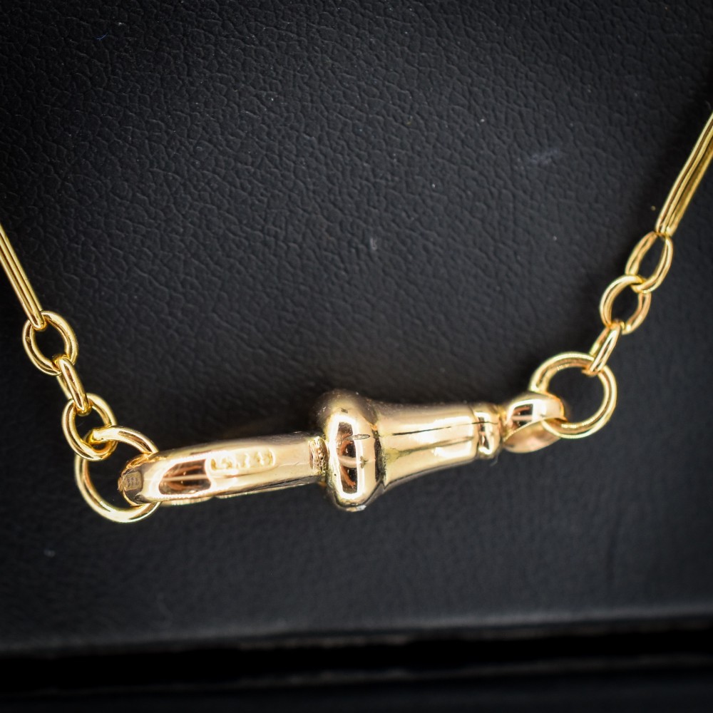An antique 9ct yellow gold paperlink chain featuring elongated rectangular links and a dog clip swivel clasp. View V