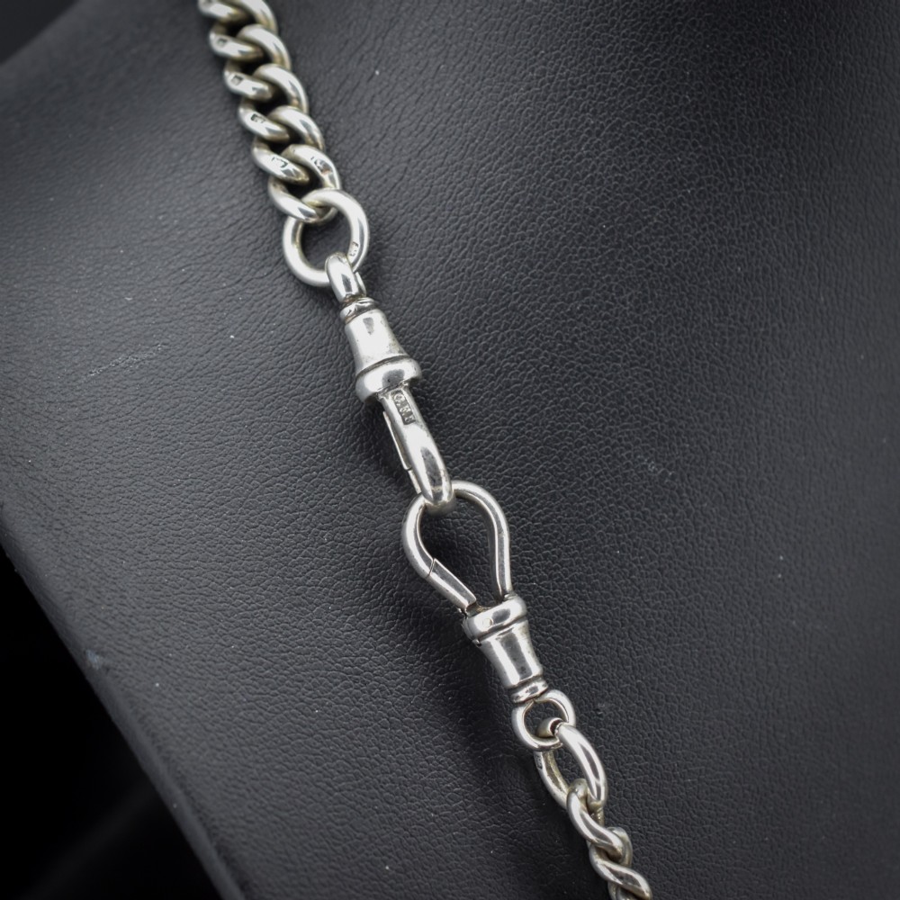 An antique sterling silver Albert watch chain featuring heavy curb links, a central T-bar drop, and two swivel dog clip clasps. View V