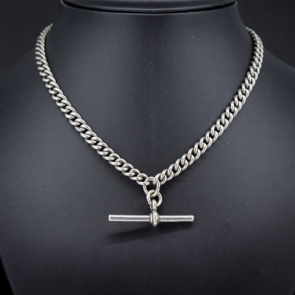 An antique sterling silver uniform curb link Albert watch chain configured as a necklace with a suspended central T-bar. View II