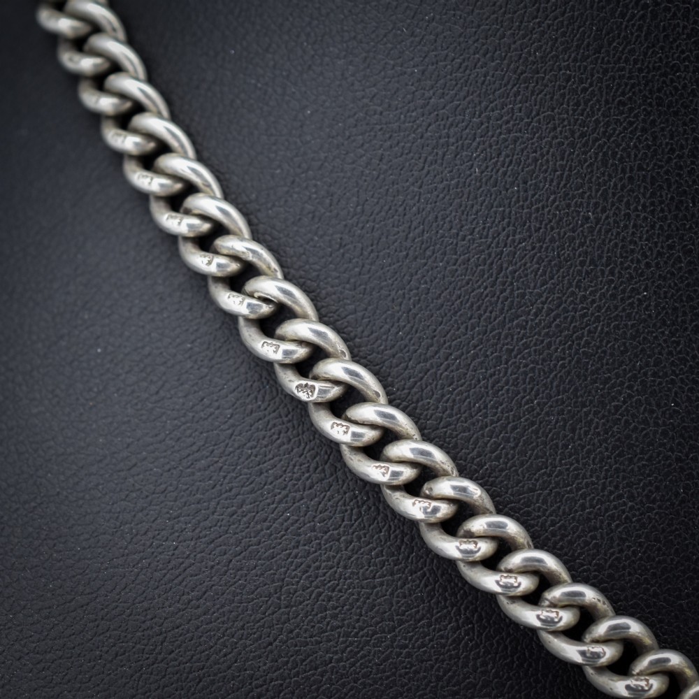 An antique sterling silver uniform curb link Albert watch chain configured as a necklace with a suspended central T-bar. View IV
