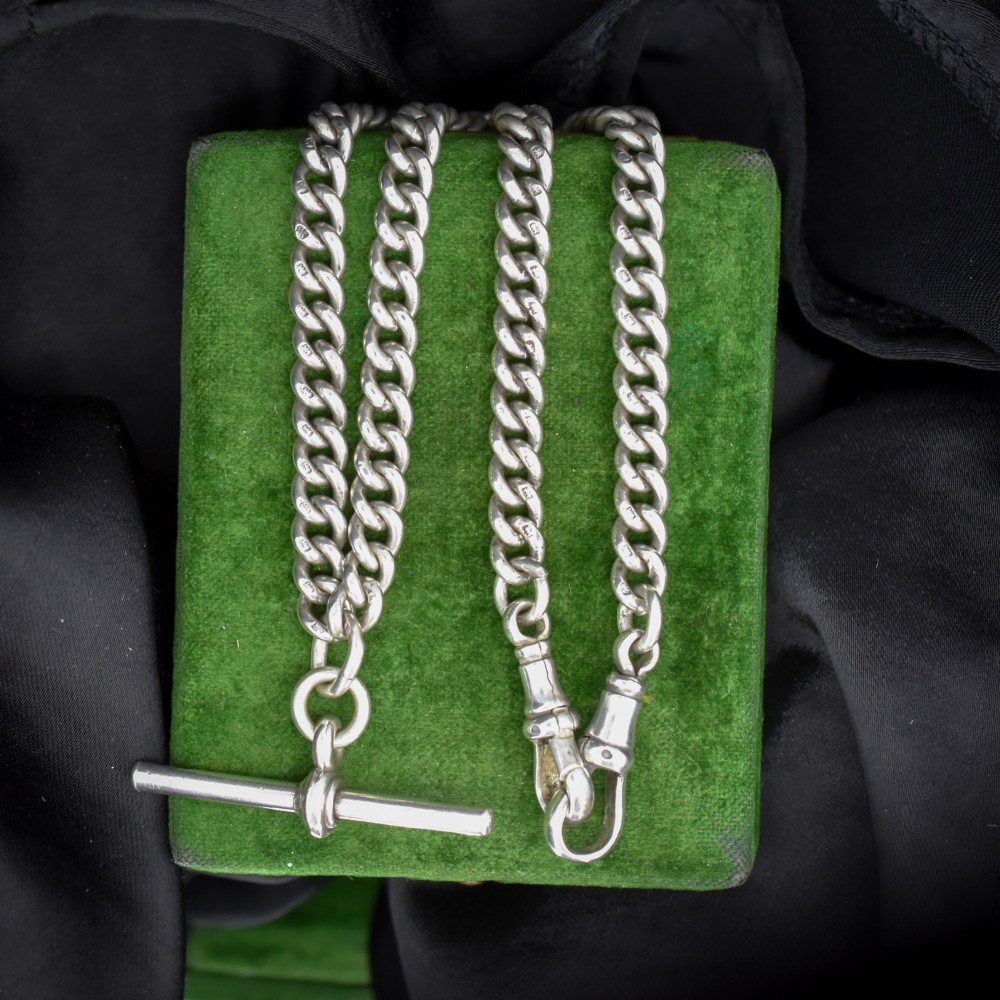 An antique sterling silver uniform curb link Albert watch chain configured as a necklace with a suspended central T-bar. View V