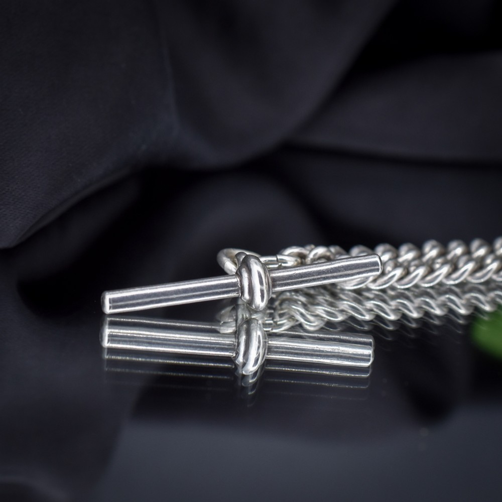 An antique sterling silver uniform curb link Albert watch chain configured as a necklace with a suspended central T-bar. View VIII