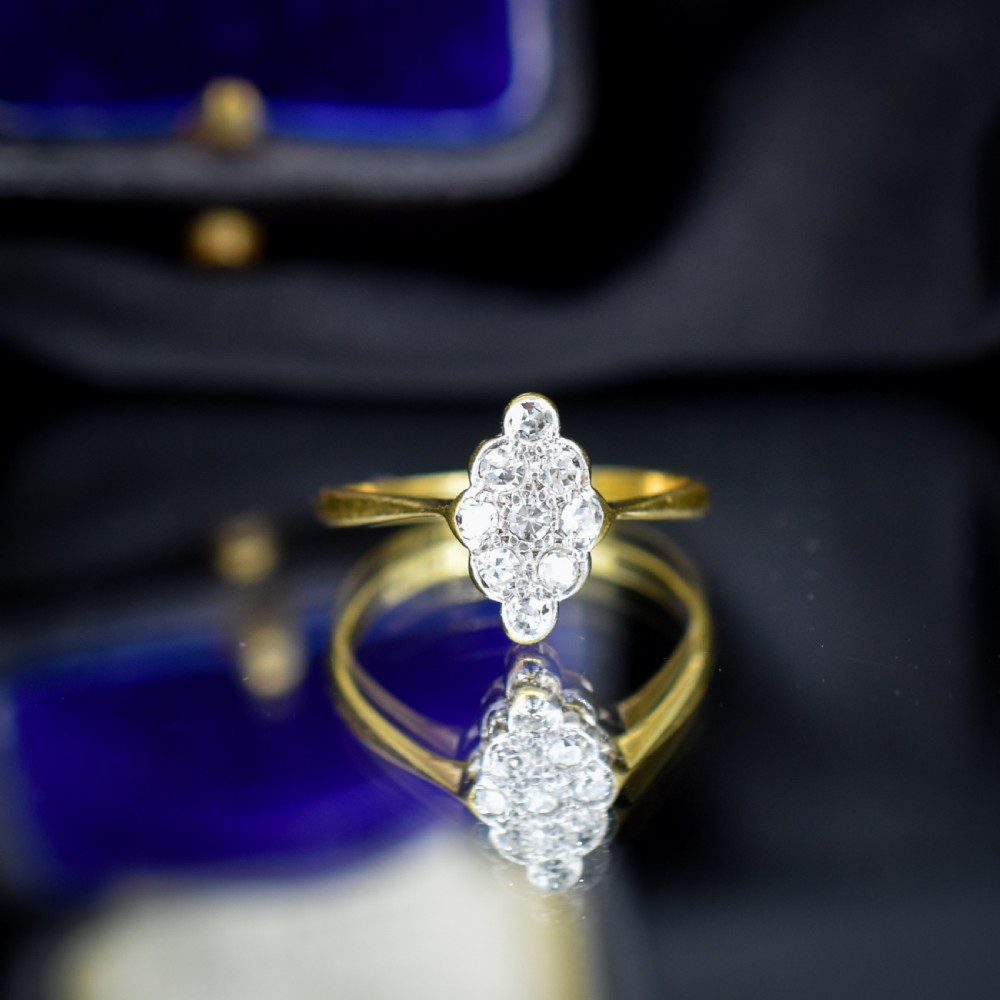 An antique diamond navette cluster ring set in platinum with an 18ct yellow gold band. View II