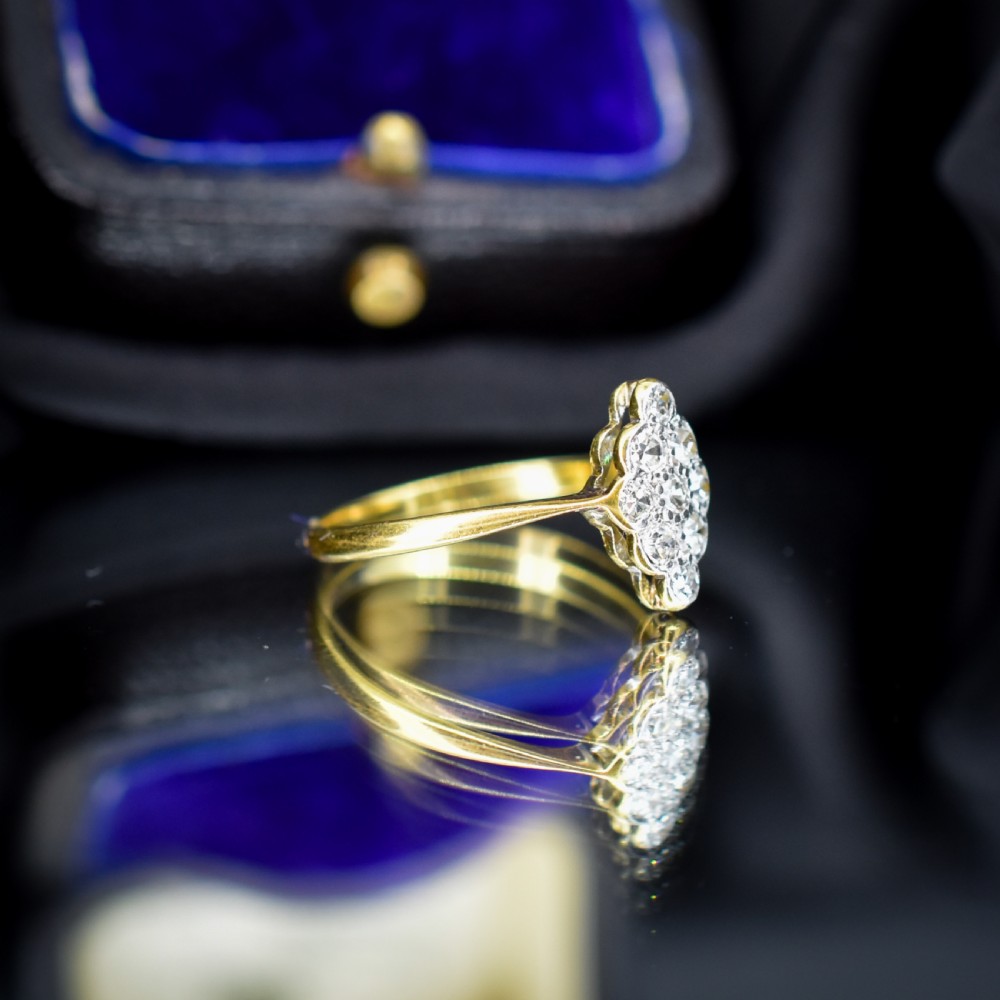 An antique diamond navette cluster ring set in platinum with an 18ct yellow gold band. View III