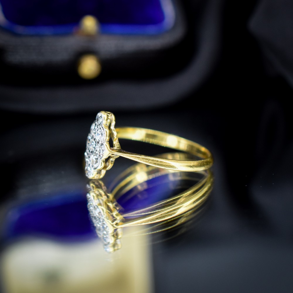 An antique diamond navette cluster ring set in platinum with an 18ct yellow gold band. View IV