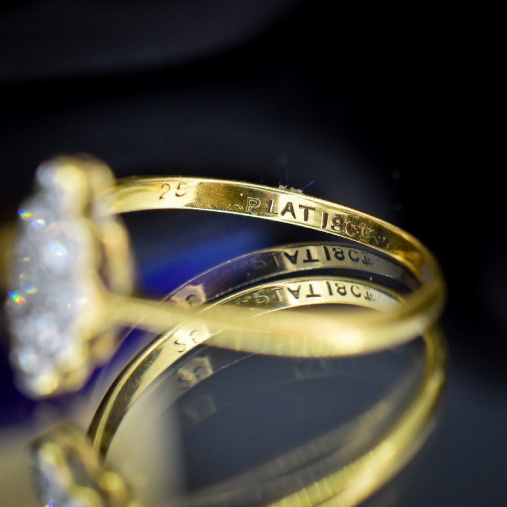 An antique diamond navette cluster ring set in platinum with an 18ct yellow gold band. View V
